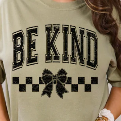 Cute “Be Kind” graphic tee with a checkered bow. Soft, comfy, and perfect for spreading positivity in everyday style.
