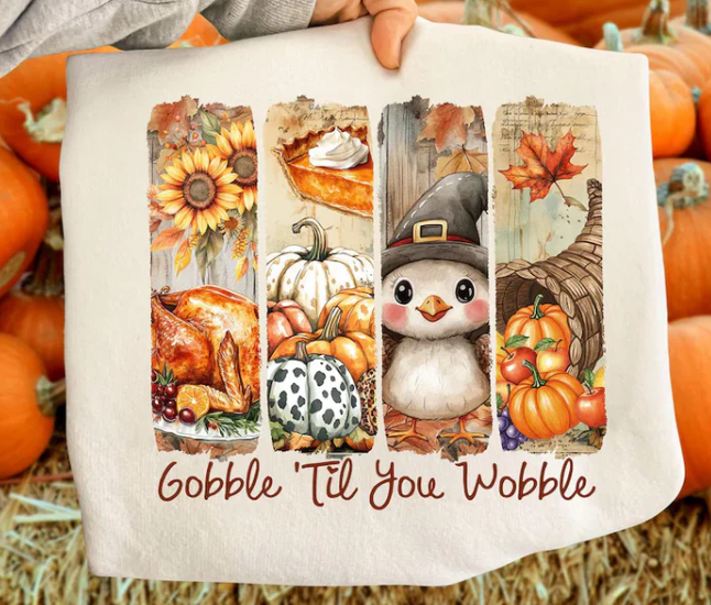 Thanksgiving sweatshirt with a turkey, cornucopia, and pilgrim penguin graphic, cozy and festive for holiday celebrations.