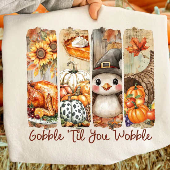 Thanksgiving sweatshirt with a turkey, cornucopia, and pilgrim penguin graphic, cozy and festive for holiday celebrations.