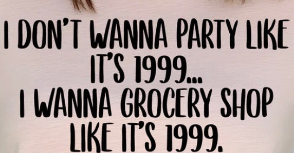 A close-up of a white t-shirt with the text 'I DON'T WANNA PARTY LIKE IT'S 1999.