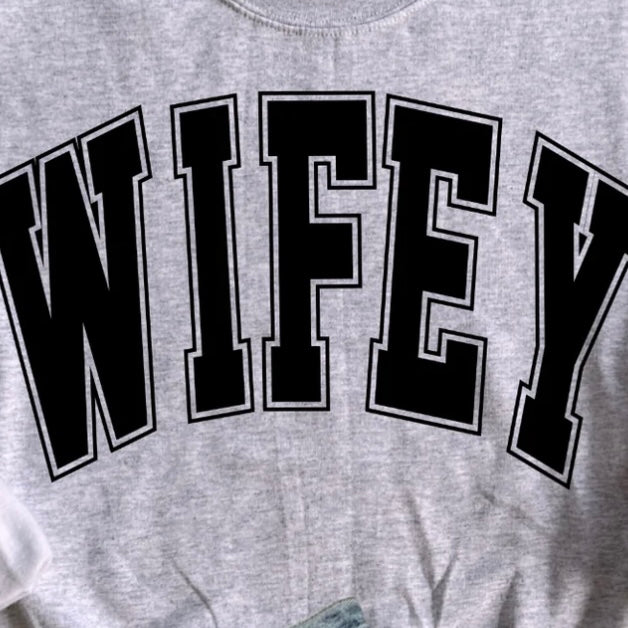 University-style Wifey graphic tee — bold, playful, and perfect for married women.