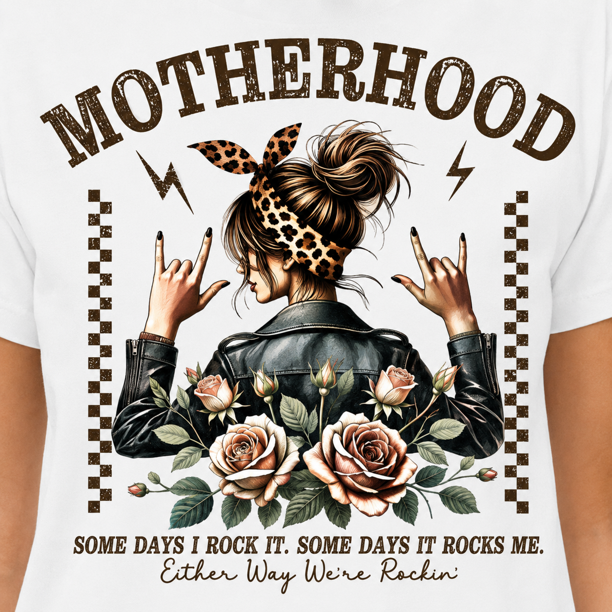T-shirt with graphic of a woman with flowers and text about motherhood on a white background