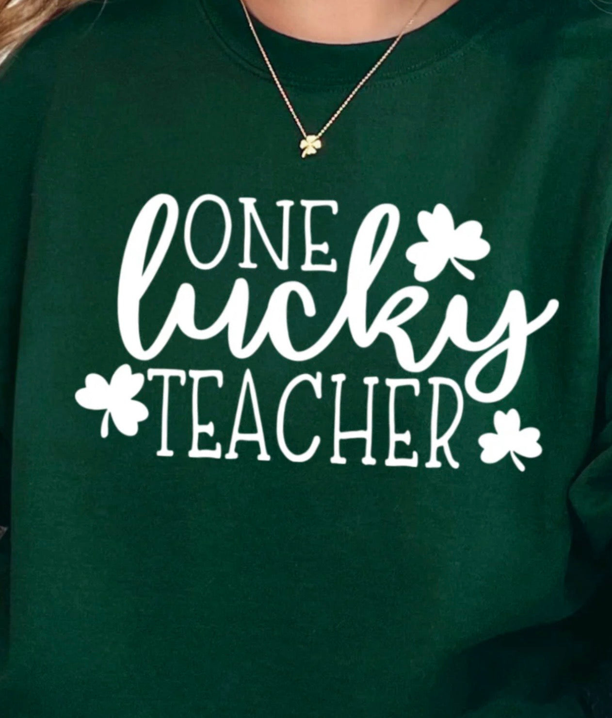 One Lucky Teacher graphic t-shirt with white ink design for St. Patrick’s Day