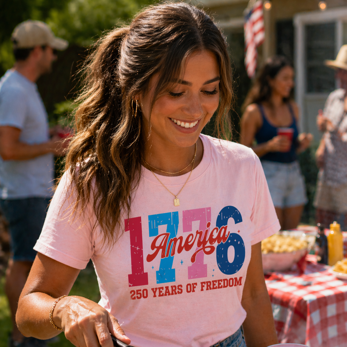 Woman wearing 1776 America pink blue patriotic shirt preppy outfit