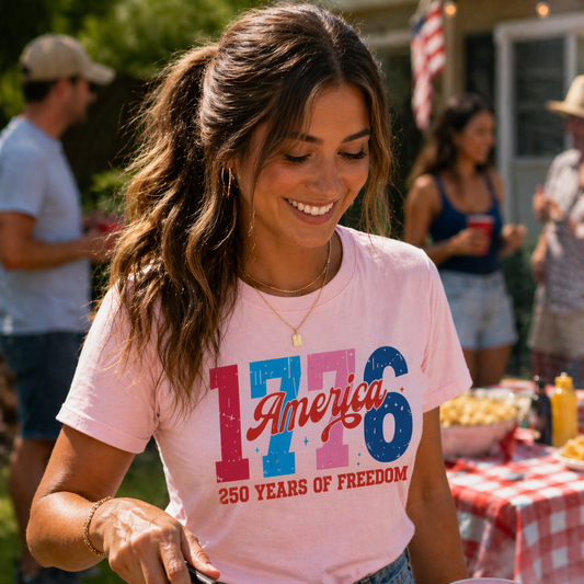 Woman wearing 1776 America pink blue patriotic shirt preppy outfit
