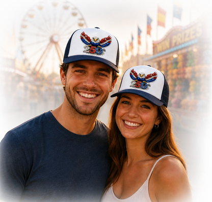 Man and woman wearing matching patriotic 250th baseball caps.