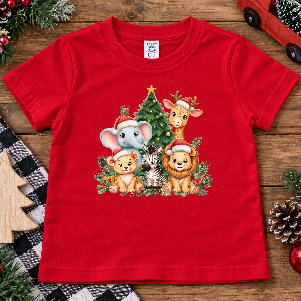 a red  toddler shirt with a christmas graphic of a tree and animals