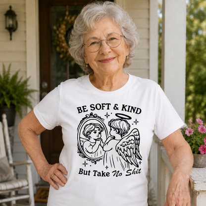 Woman wearing a white t-shirt with an angel graphic and text on a porch.