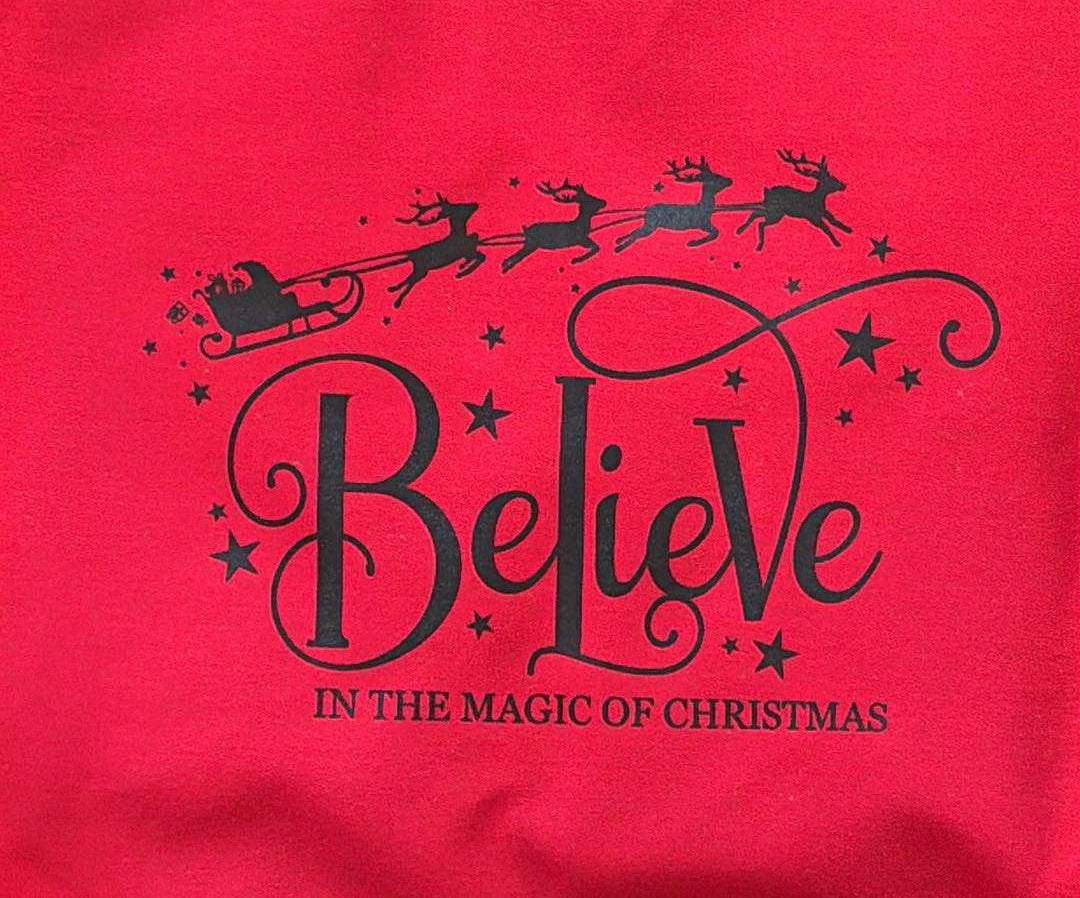 Cozy up this holiday season with our Believe In The Magic Of Christmas sweatshirt — perfect for lounging, gifting, or spreading festive cheer!