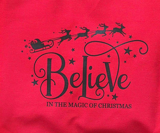 Cozy up this holiday season with our Believe In The Magic Of Christmas sweatshirt — perfect for lounging, gifting, or spreading festive cheer!