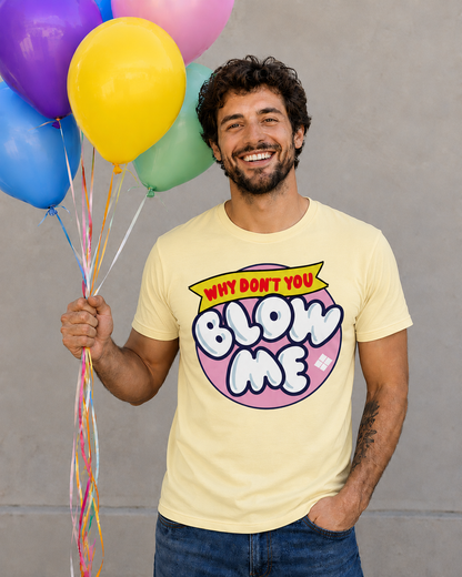 Man wearing a banana colored t-shirt with a humorous graphic and text, holding colorful balloons against a plain background.