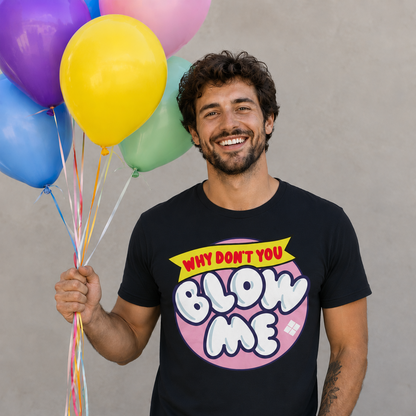 Man wearing a graphite colored  t-shirt with colorful text holding balloons against a plain background