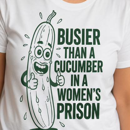 White t-shirt with a cartoon cucumber graphic and text on a white background