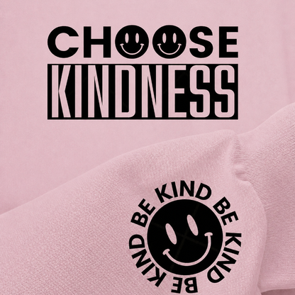 Light pink sweatshirt with 'Choose Kindness' text and smiley face design.