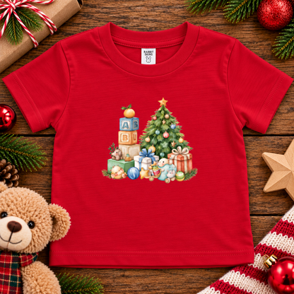 A red colored toddler t-shirt with a Christmas graphic with a tree, blocks and presents