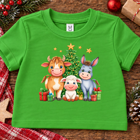 An apple green colored toddler t-shirt with a christmas theme graphic including farm animals and presents
