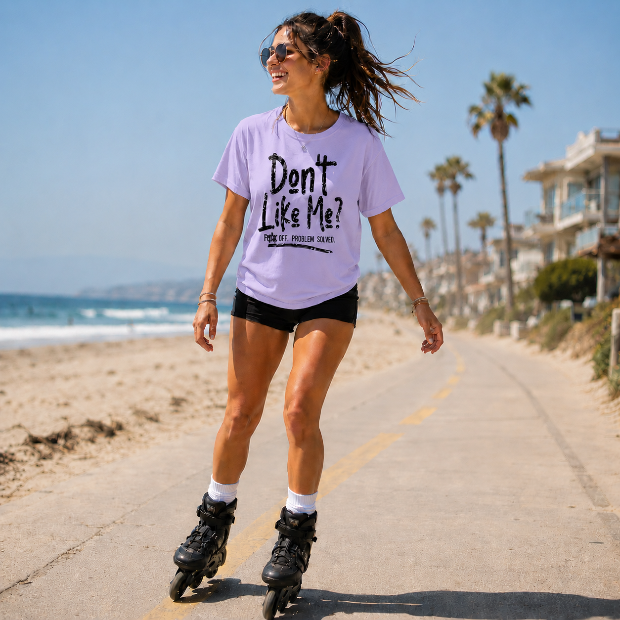 Woman wearing a orchid colored t-shirt with the text Don't like me? F off problem solved
