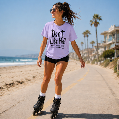 Woman wearing a orchid colored t-shirt with the text Don't like me? F off problem solved