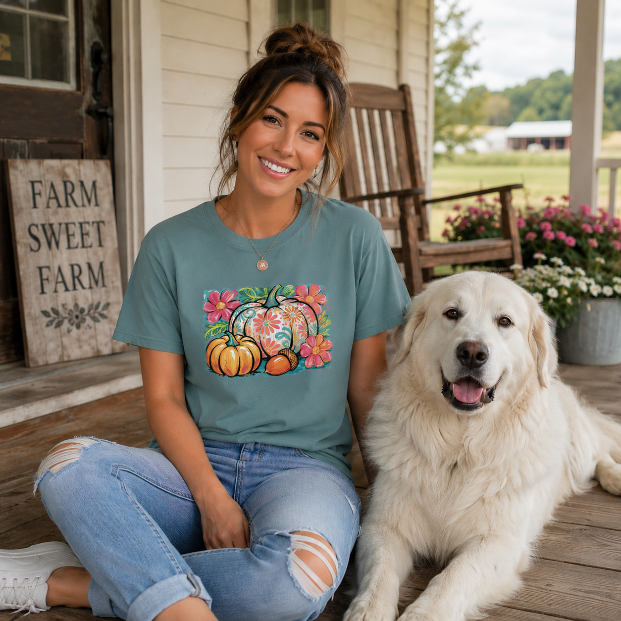 Women wearing a blue spruce colored t-shirt with a floral pumpkin graphic design
