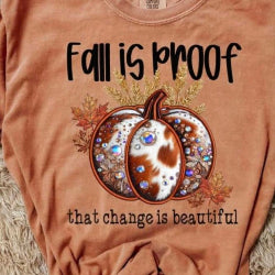 Autumn graphic t-shirt with the phrase “Fall Is Proof That Change Is Beautiful” in faux-embroidery style.