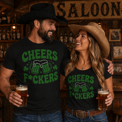 Two people in a saloon wearing matching 'Cheers F*ckers' shirts with drinks.