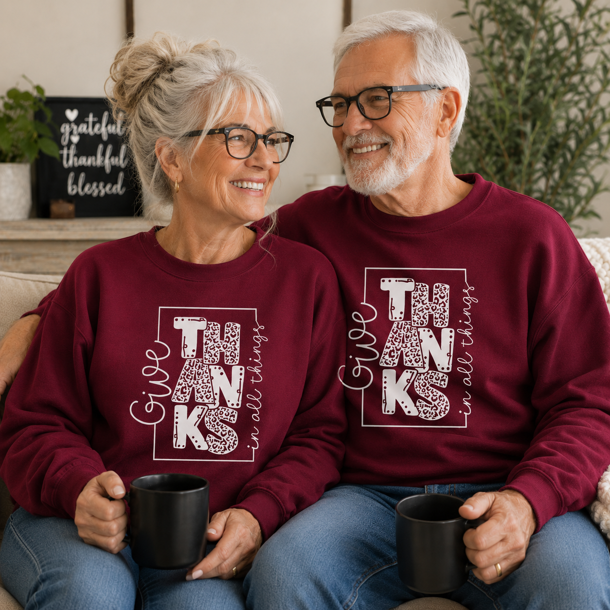 People wearing a cardinal red sweatshirt with text “Give Thanks in All Things” soft, comfy, and perfect for Thanksgiving or everyday fall wear.
