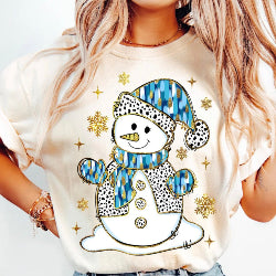 Ivory Christmas graphic tee with cheerful glitter snowman design, perfect for festive holiday outfits.