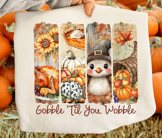 Thanksgiving sweatshirt with a turkey, cornucopia, and pilgrim penguin graphic, cozy and festive for holiday celebrations.
