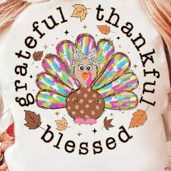 Thanksgiving sweatshirt with “Grateful, Thankful, Blessed” text and colorful turkey with bow, cozy fall apparel.