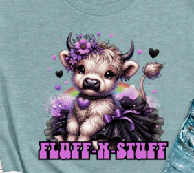 Graphic t-shirt featuring a Highland cow in a black tutu with purple accessories, soft, playful, and cute for everyday casual wear.