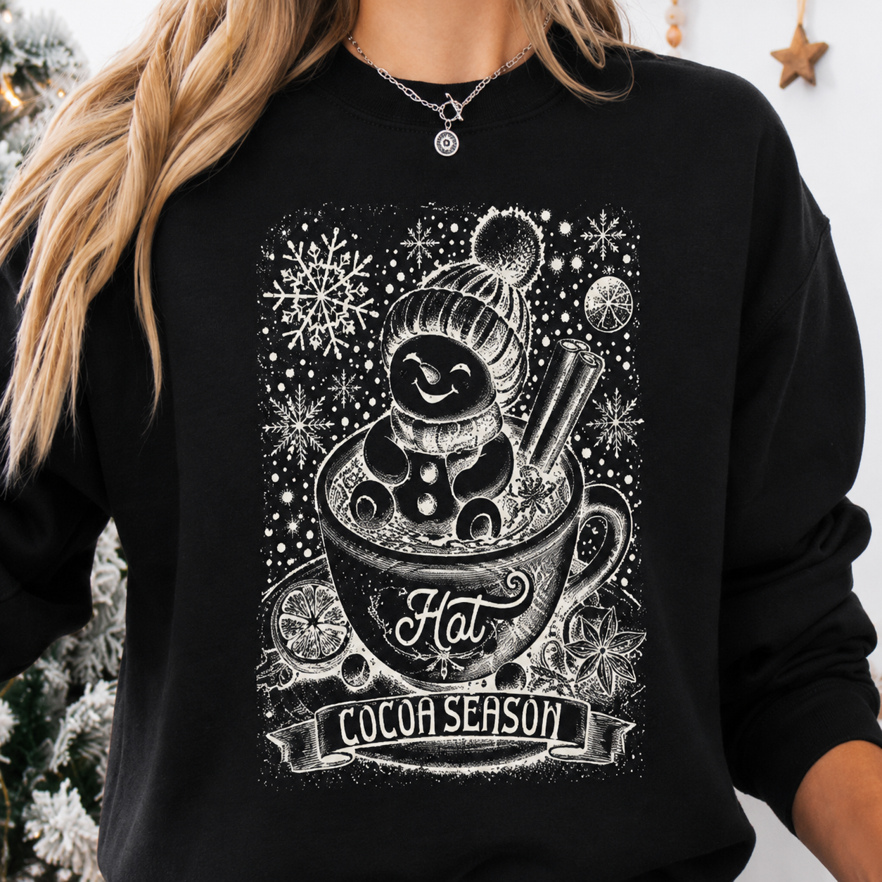 Cozy black sweatshirt featuring a snowman soaking in a mug of hot chocolate, perfect for Christmas and holiday festivities.