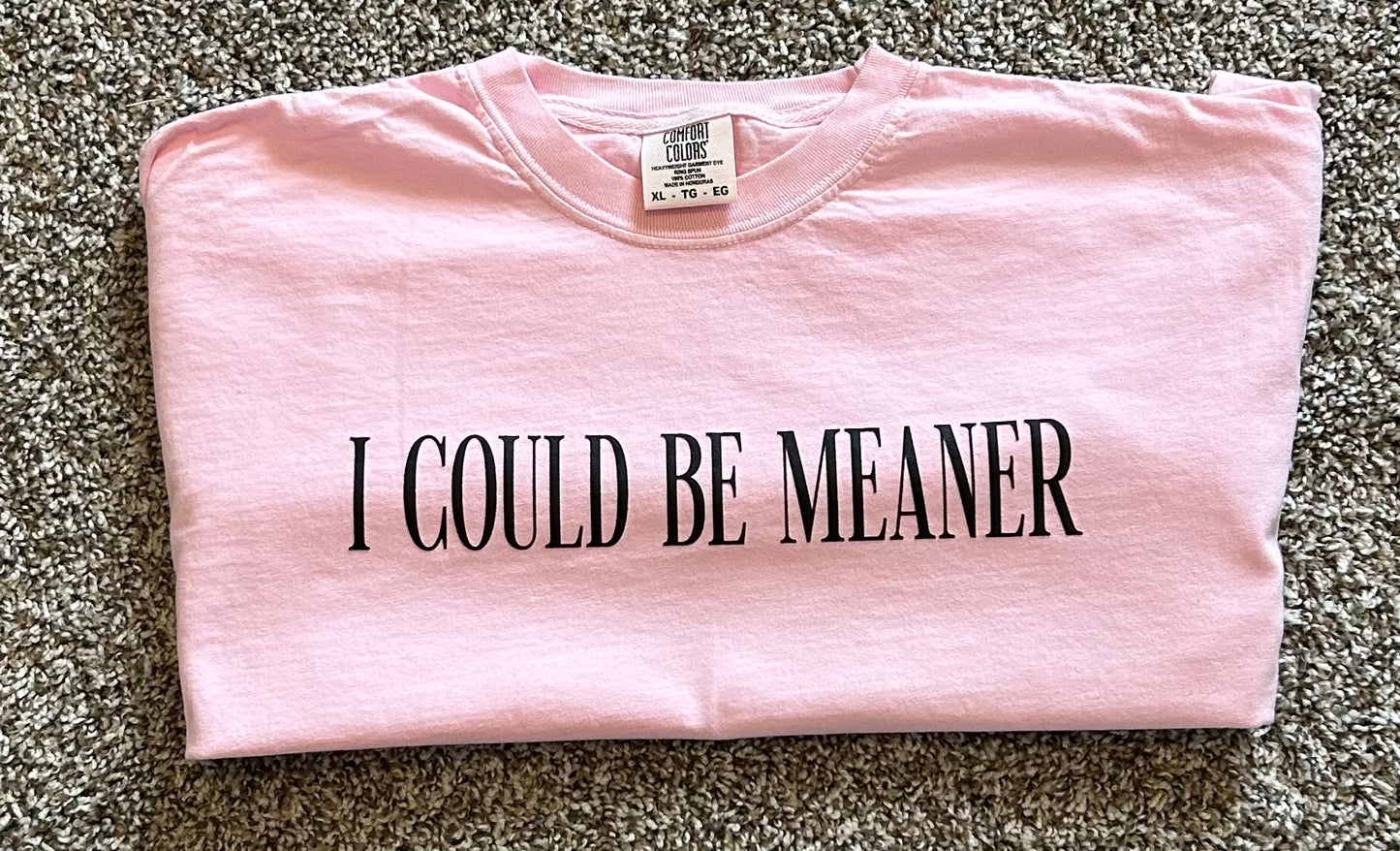 I Could Be Meaner graphic t-shirt with bold black lettering on neutral background