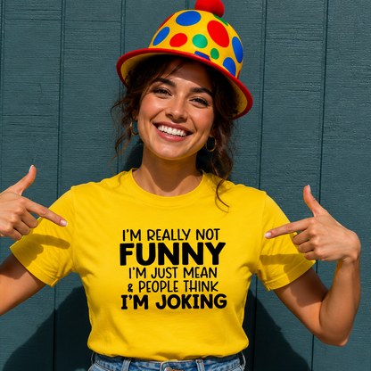 Person wearing a yellow t-shirt with humorous text and a colorful hat against a blue wall.