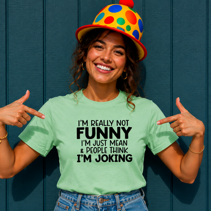 Woman wearing a light green t-shirt with text and a colorful clown hat against a blue wall.