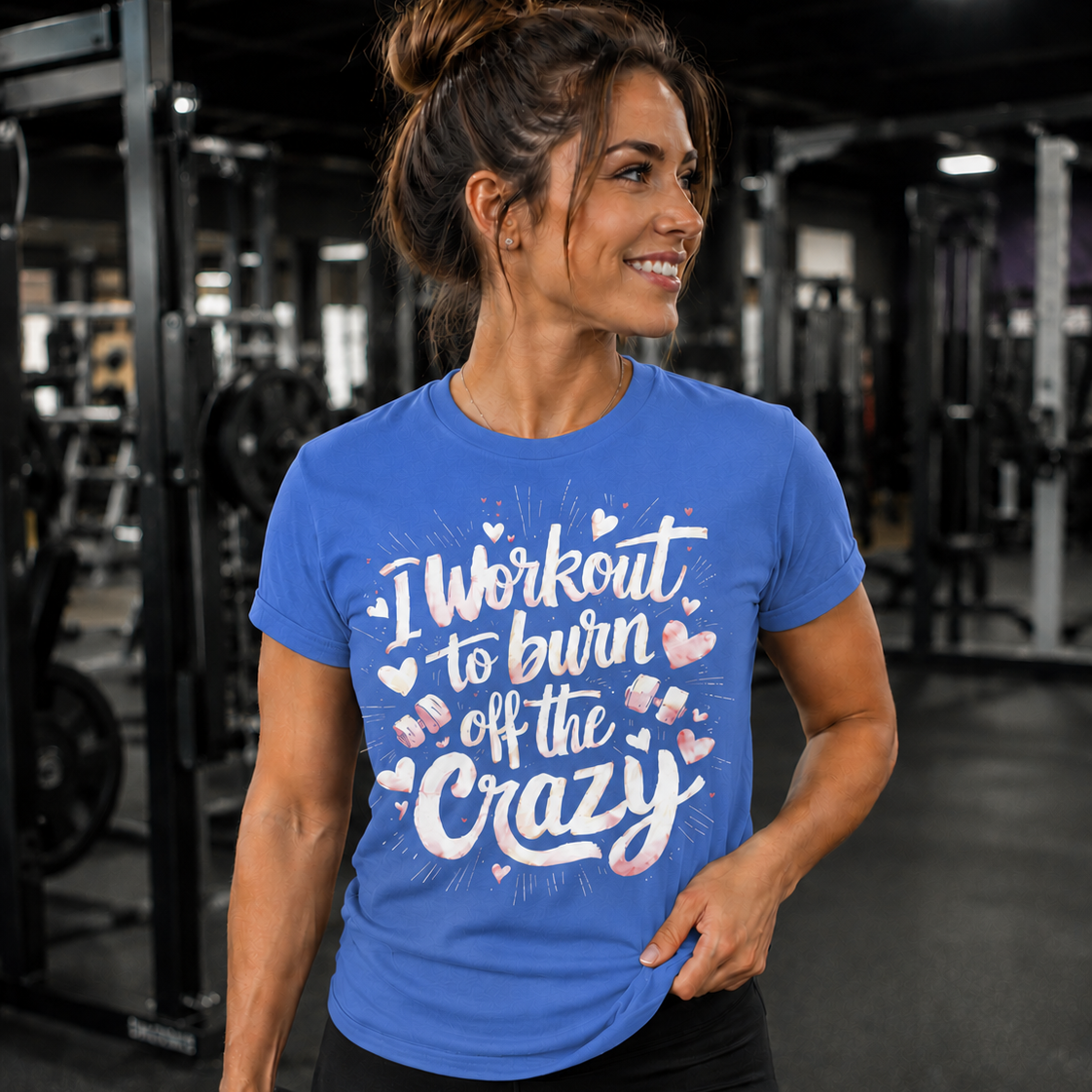 Woman in a gym wearing a flo blue t-shirt with a humorous fitness quote.