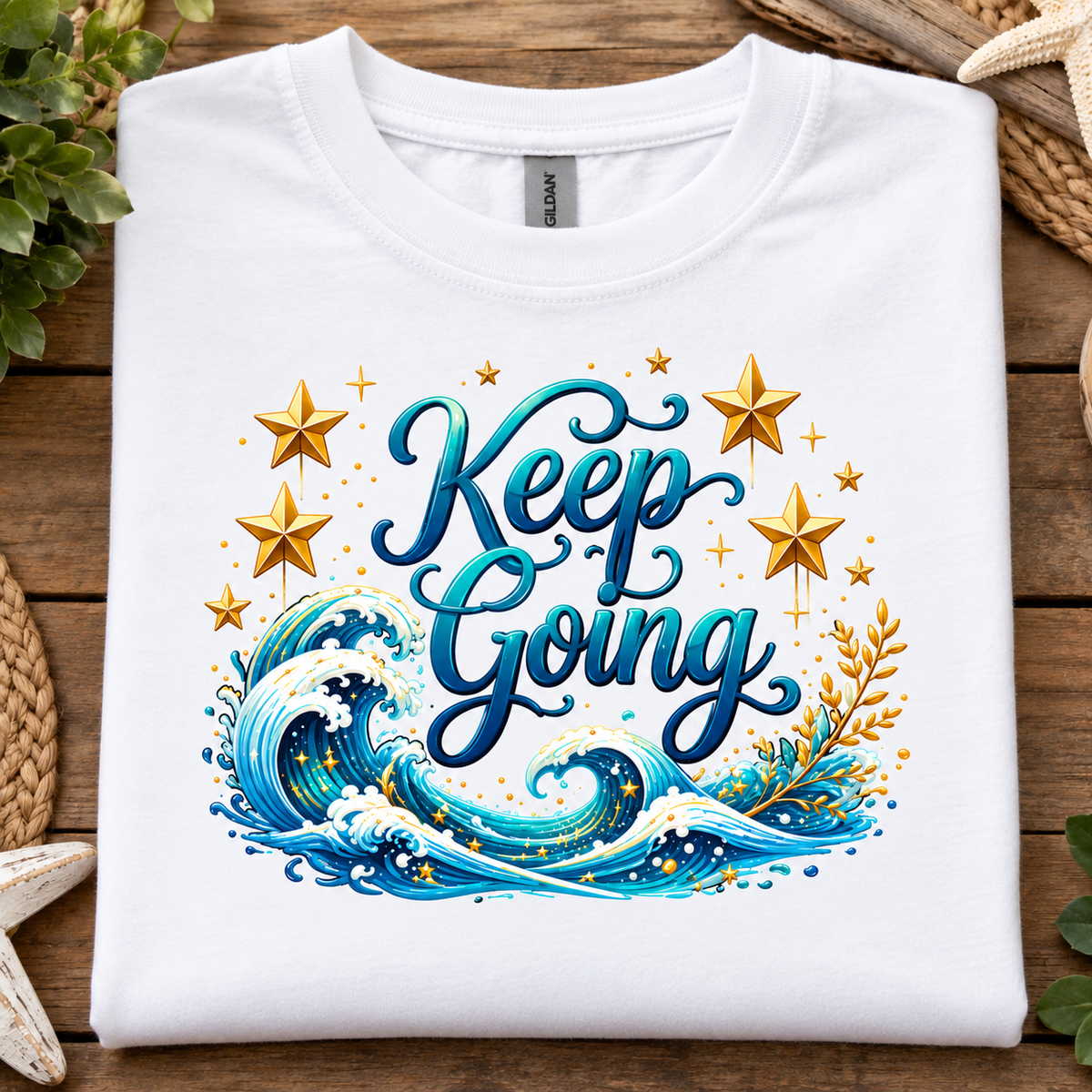White t-shirt with a ocean and stars graphic with text Keep Going