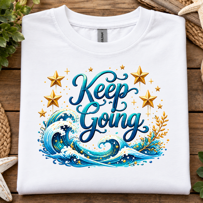 White t-shirt with a ocean and stars graphic with text Keep Going