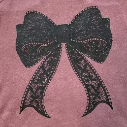 Lacey Bow Racerback Tank with printed lace-style bow graphic, styled for a coquette-inspired summer look.