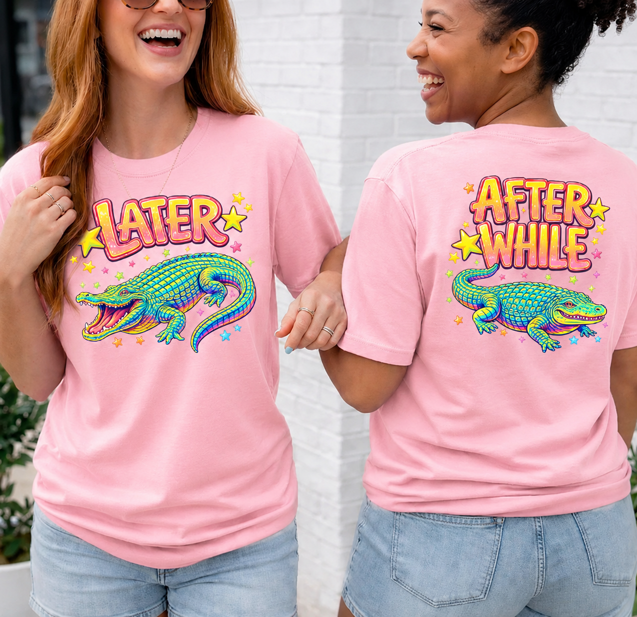 Two people wearing pink t-shirts with colorful alligator graphics and text.