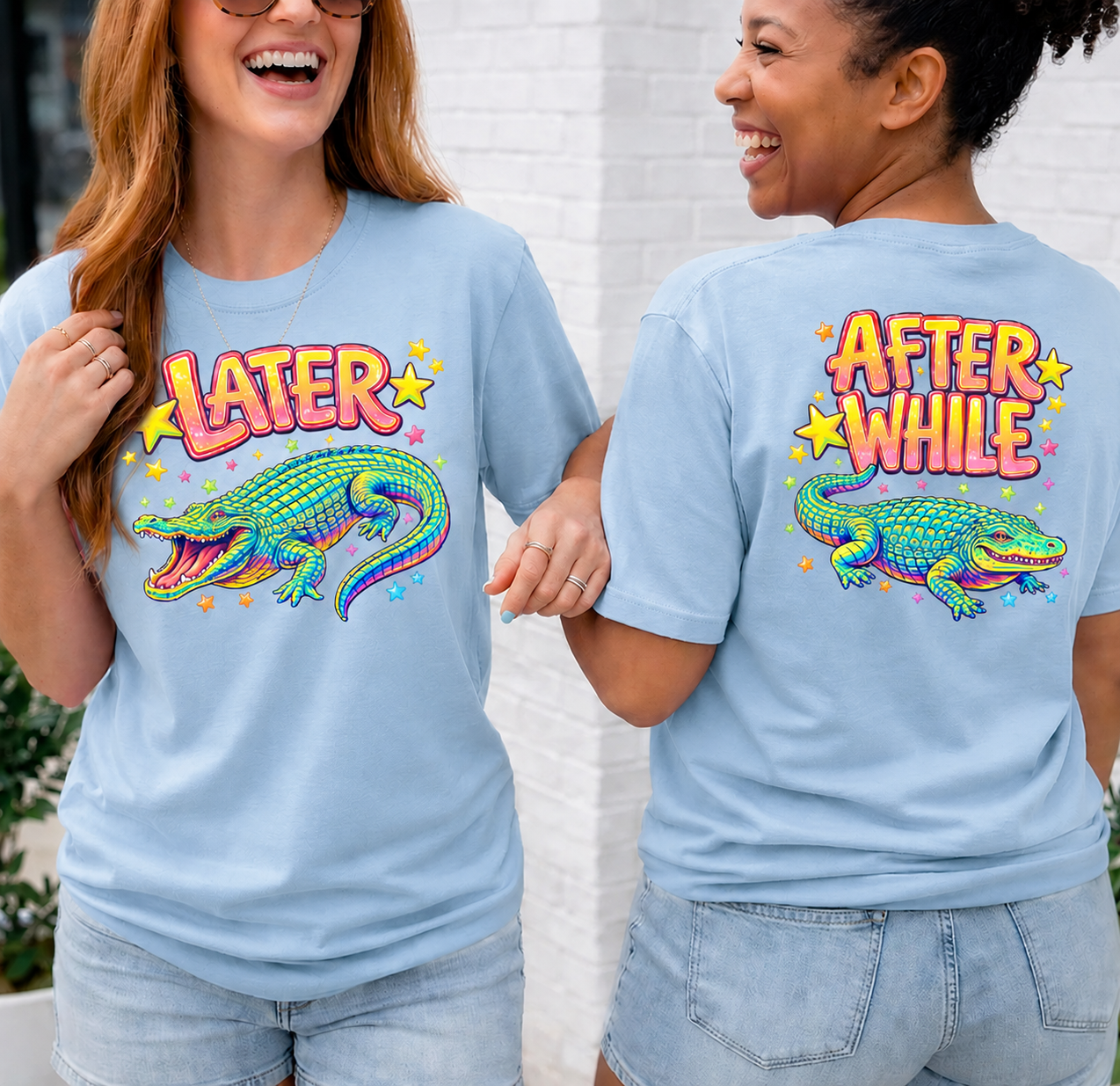 Two people wearing light blue t-shirts with colorful alligator graphics and text.