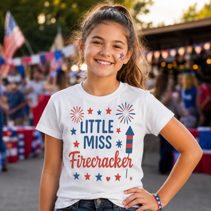 Young girl wearing a 'Little Miss Firecracker' shirt with a festive background.