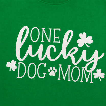 'One lucky dog mom' text and white shamrock designs on a green background