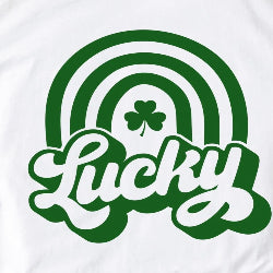 White sweatshirt with green rainbow and shamrock design on a white background