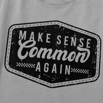 Gray sweatshirt with a black and white graphic and text 'Make Sense Common Again' on a gray background