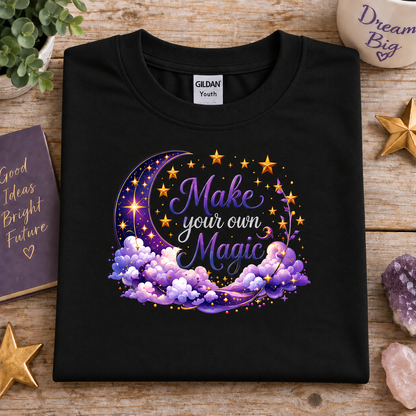 Black t-shirt with moon, stars and clouds graphic with the Text Make your own Magic