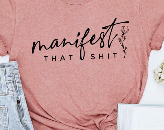 Manifest That Sh*t motivational graphic t-shirt with bold quote design