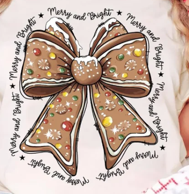 Christmas t-shirt featuring a gingerbread-style bow and “Merry and Bright” design, soft and festive for baking or holiday gatherings.