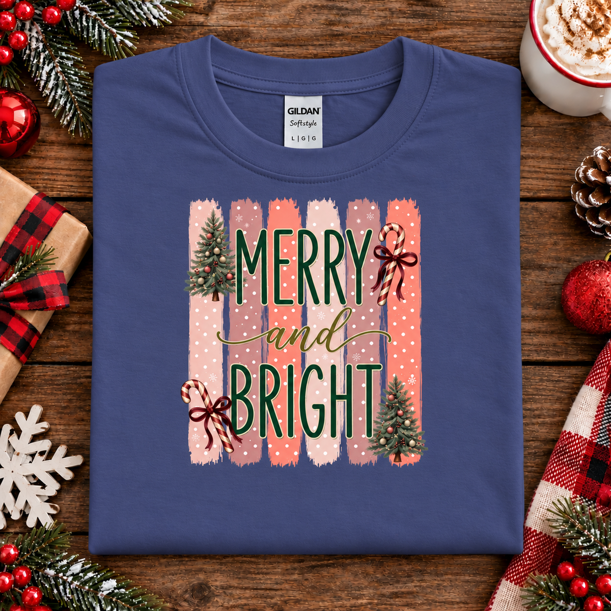 Merry and Bright Christmas graphic on a purple sweatshirt with striped pink and coral background, white polka dots, green lettering, candy canes with red bows, and two decorated Christmas trees.