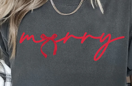 Minimalist Merry Bow graphic t-shirt with simple holiday lettering and bow design.