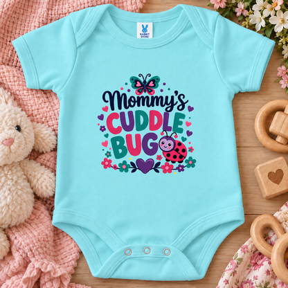 A chill blue colored onesie bodysuit has a colorful graphic reading “Mommy’s Cuddle Bug” with a butterfly, flowers, hearts, and a ladybug.